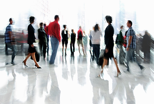 people walking through building