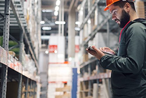 worker in logistics with tablet