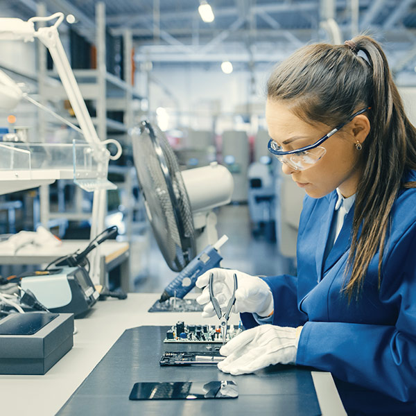 decorative image showing woman working in manufacturing